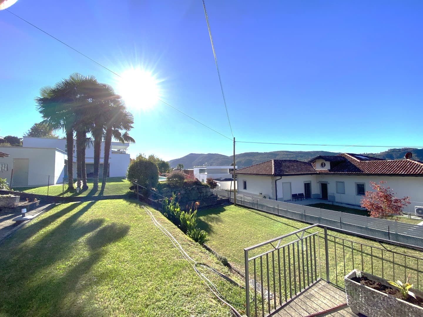 DETACHED HOUSE SURROUNDED BY GREENLAND WITH A GARDEN AND OPEN VIEWS OF THE MOUNTAINS