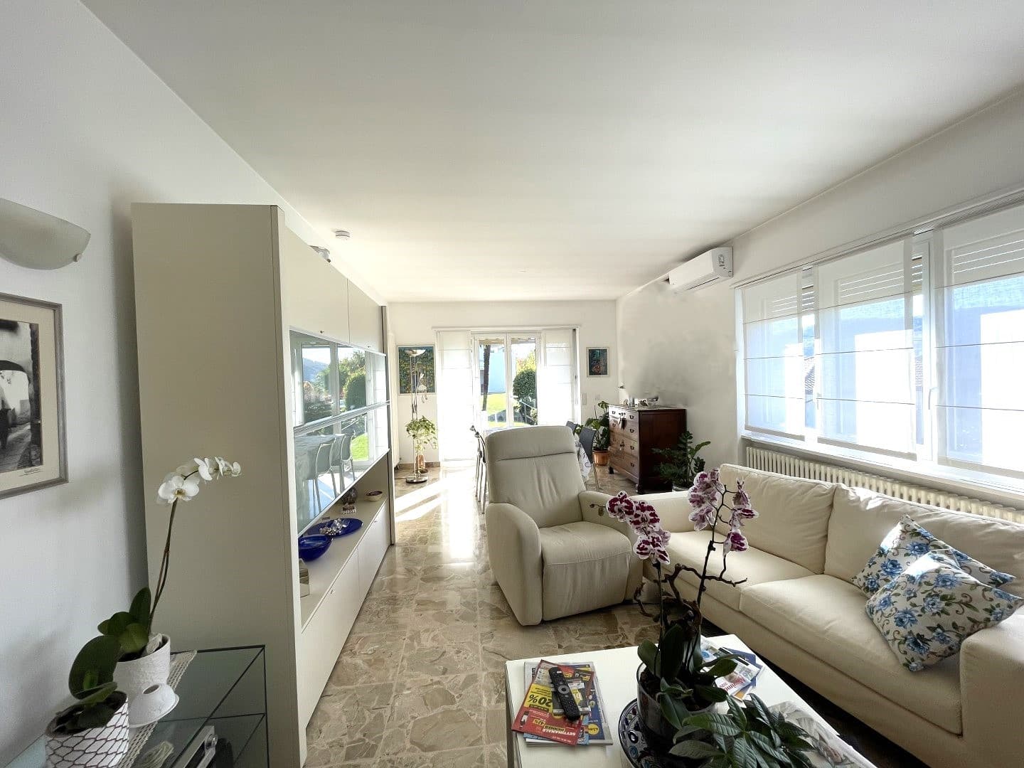 DETACHED HOUSE SURROUNDED BY GREENLAND WITH A GARDEN AND OPEN VIEWS OF THE MOUNTAINS